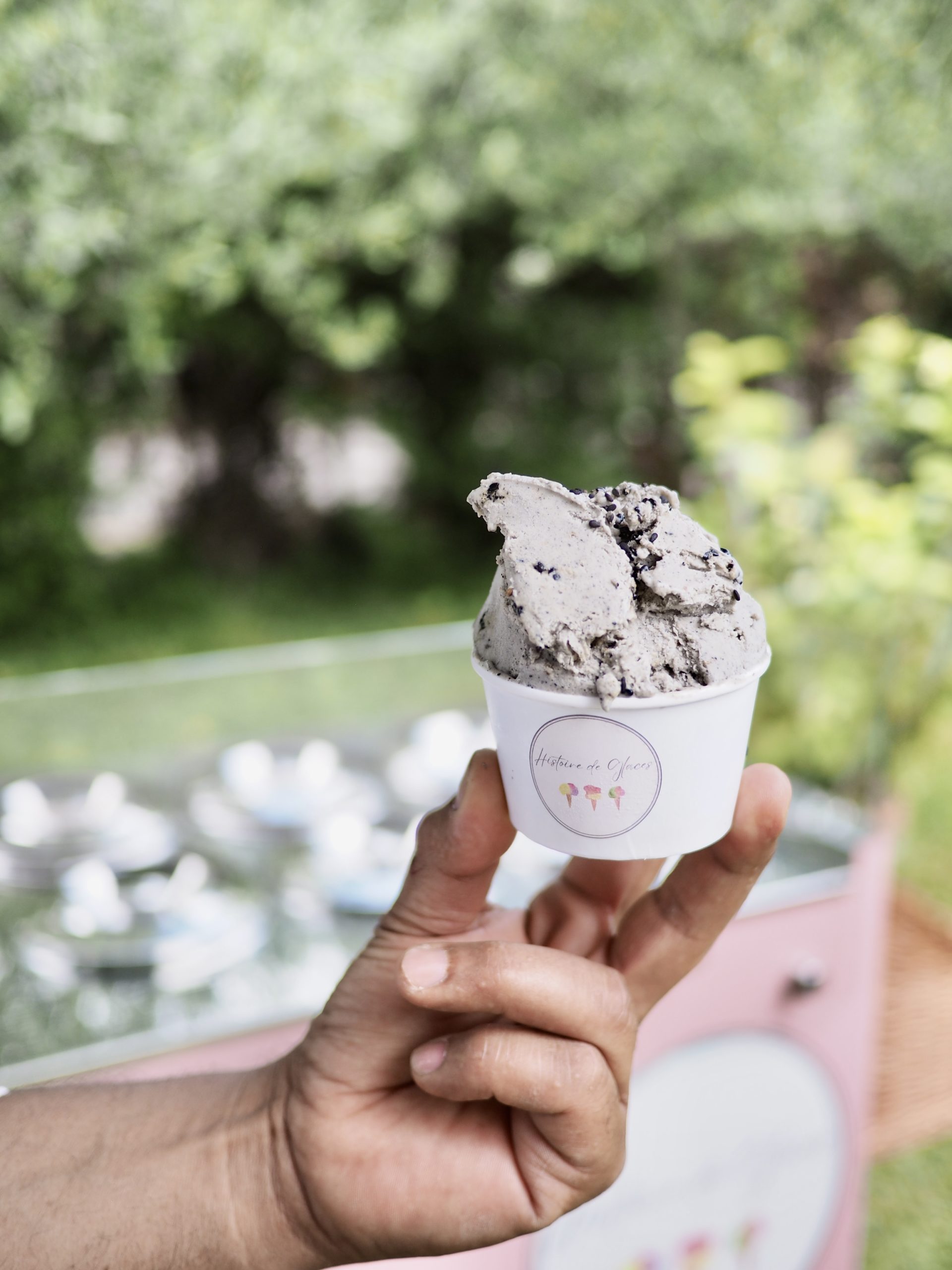 person holding cone with icecream