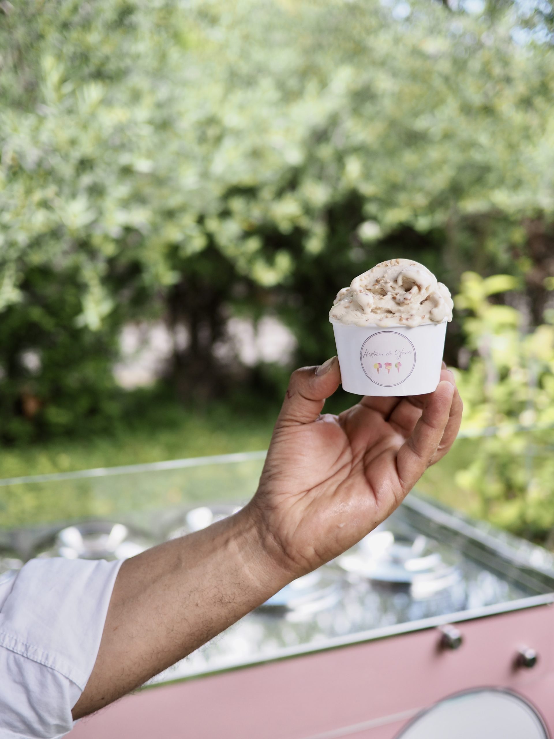 person holding ice cream in cone