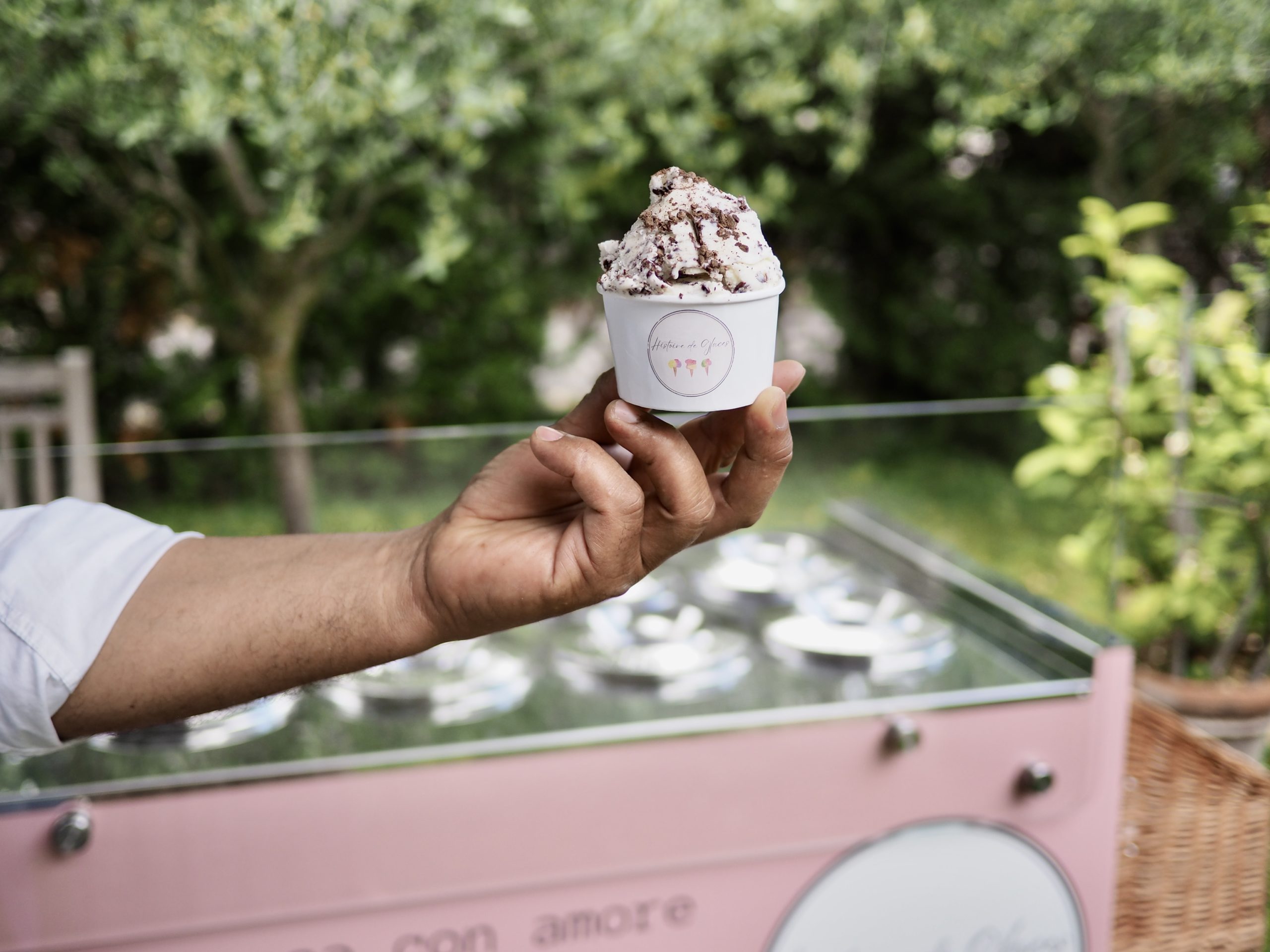 person holding cone with icecream