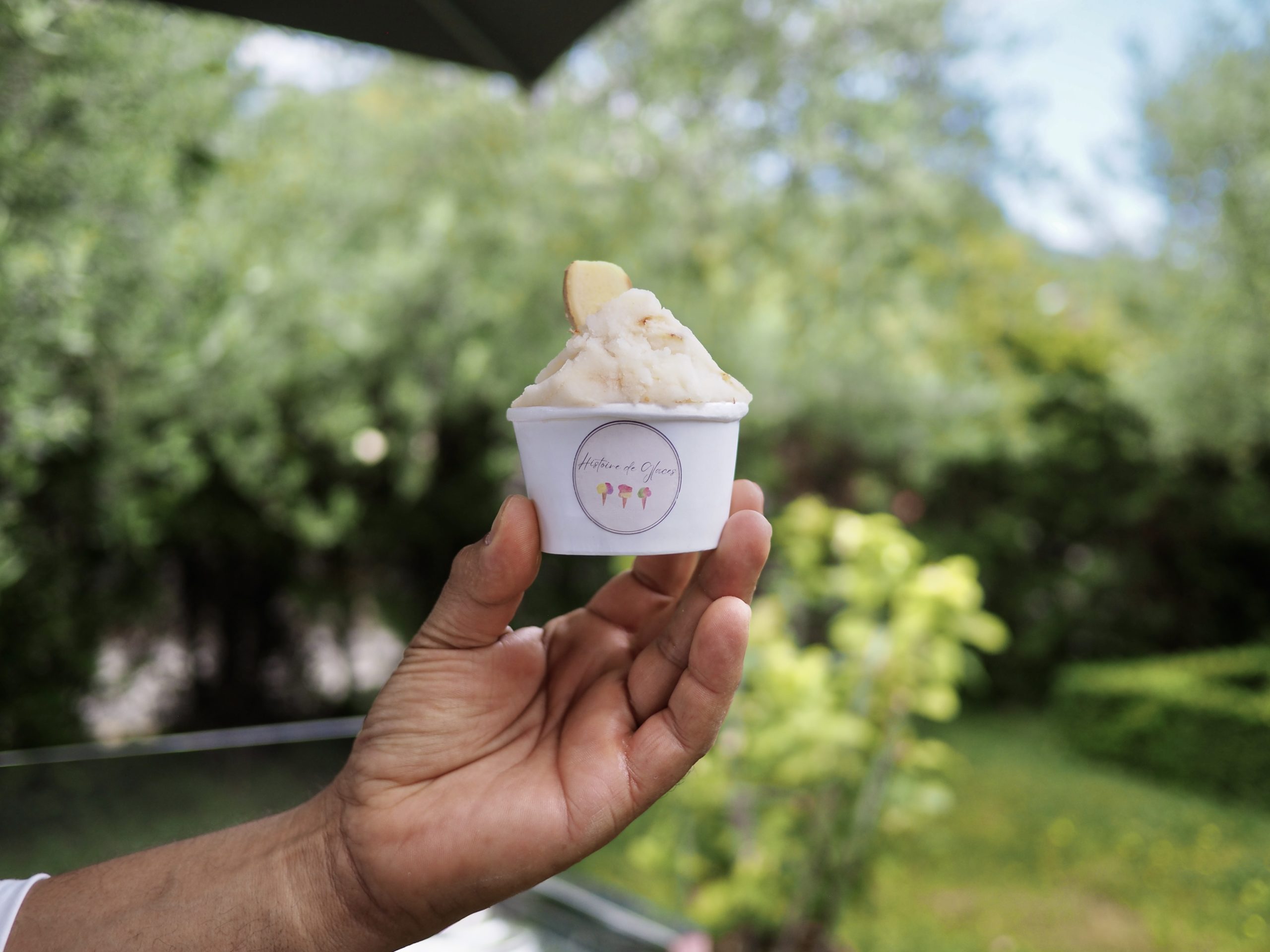 person holding ice cream in cone